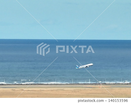 (Taken from the northern lands) Blue sky, sea, and a plane taking off. (Taken from the northern lands) Blue sky, sea, and a plane taking off. 140153596