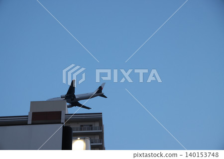 April 25 2026 City Hotel Building With Airplane Flying Overhead April 25 2026 City Hotel Building With Airplane Flying Overhead 140153748