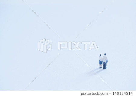 A large blank space and miniature high school couple A large blank space and miniature high school couple 140154514