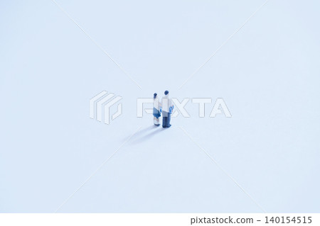 A large blank space and miniature high school couple A large blank space and miniature high school couple 140154515