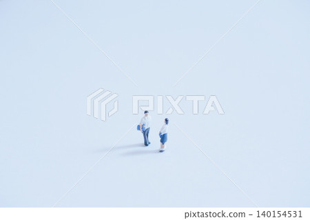 A large blank space and miniature high school couple A large blank space and miniature high school couple 140154531