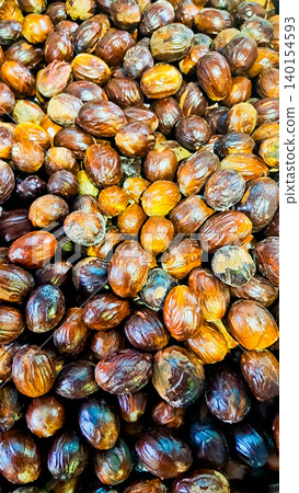 close-up photo of nutmeg, a spice used in traditional Indonesian food and medicine close-up photo of nutmeg, a spice used in traditional Indonesian food and medicine 140154593