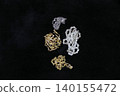 Precious metals, gold bars, rings, necklaces, ornaments, gemstones 140155472