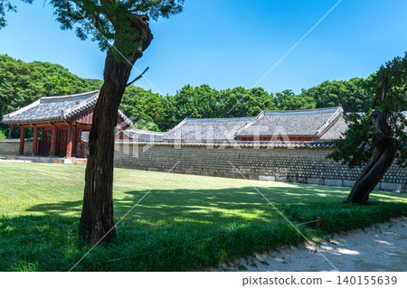 Seoul, South Korea - May. 30, 2026 : A peaceful view of the Yeongnyeongjeon Hall at Jongmyo Shrine in Seoul, South Korea, under a clear blue sky on a bright early summer afternoon 140155639