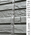 Exterior wall with deteriorated caulking 140155754