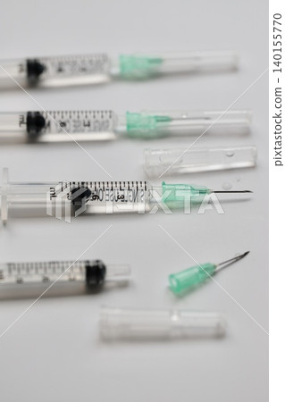 A 1ml syringe with a needle containing injection solution; image of vaccination. A 1ml syringe with a needle containing injection solution; image of vaccination. 140155770
