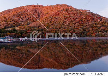 Mount Akagi and Jizodake at dawn, as seen from the shore of Lake Onuma. Mount Akagi and Jizodake at dawn, as seen from the shore of Lake Onuma. 140156920