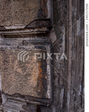 Texture of a 19th-century architectural half column with cracked plaster. Texture of a 19th-century architectural half column with cracked plaster. 140157098