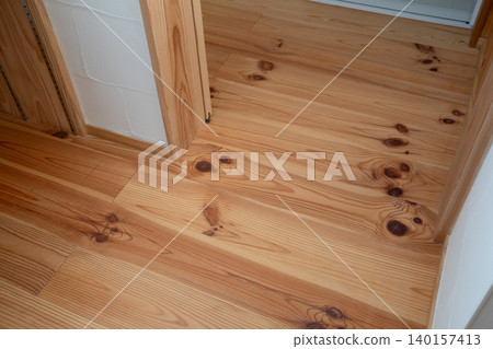 Solid wood flooring in a detached house made from natural wood. 140157413