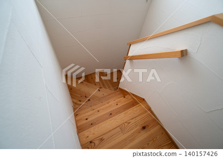 Staircase and handrail made of natural wood for a Japanese house. Staircase and handrail made of natural wood for a Japanese house. 140157426