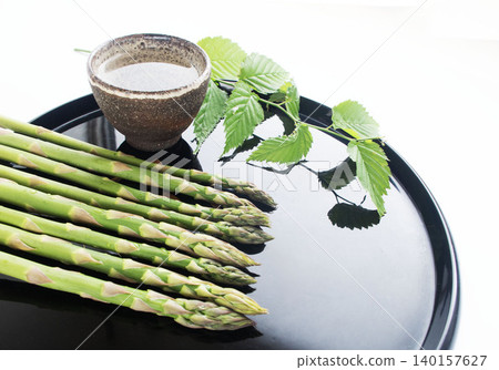 Asparagus, a seasonal vegetable, a perfect accompaniment to drinks, a Japanese-style snack. Asparagus, a seasonal vegetable, a perfect accompaniment to drinks, a Japanese-style snack. 140157627