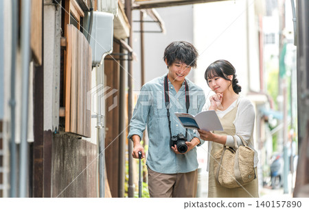Young couples taking city walks and sightseeing tours on domestic trips Young couples taking city walks and sightseeing tours on domestic trips 140157890
