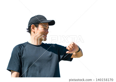 A middle-aged man in sportswear uses a smartwatch, pedometer, and step counter to manage his health and healthcare. A middle-aged man in sportswear uses a smartwatch, pedometer, and step counter to manage his health and healthcare. 140158170