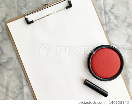 Important contracts and procedures, documents on a clipboard with red ink, black seal, binder and stamp. Important contracts and procedures, documents on a clipboard with red ink, black seal, binder and stamp. 140158543