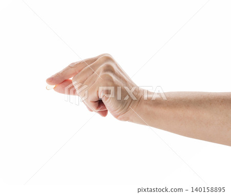 Mid aged female hold transparent pill isolated on white Mid aged female hold transparent pill isolated on white 140158895