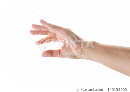 Mid aged female hold transparent pill isolated on white Mid aged female hold transparent pill isolated on white 140158903