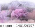 A beautiful landscape of cherry trees and mountains shrouded in mist. 140159357