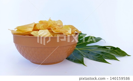 Keripik sukun or breadfruit chips are a traditional Indonesian food made from breadfruit (Artocarpus altilis). Keripik sukun or breadfruit chips are a traditional Indonesian food made from breadfruit (Artocarpus altilis). 140159586