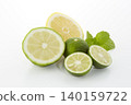 Citrus fruits placed on a white background: lime, lemon, and sudachi. 140159722