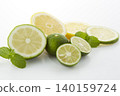 Citrus fruits placed on a white background: lime, lemon, and sudachi. 140159724