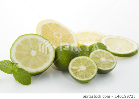 Citrus fruits placed on a white background: lime, lemon, and sudachi. 140159725