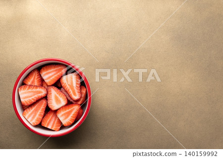 Fresh sliced strawberries in bowl Fresh sliced strawberries in bowl 140159992