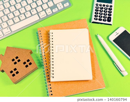 A blank notebook and home, a PC, a smartphone and a calculator A blank notebook and home, a PC, a smartphone and a calculator 140160794