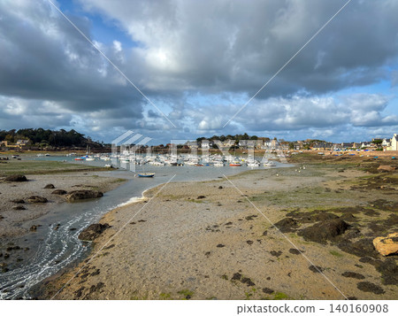 Harbor low tide revealing moored boats in Tregastel Brittany France Harbor low tide revealing moored boats in Tregastel Brittany France 140160908