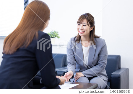 A woman in business, sales, or negotiation. A woman in business, sales, or negotiation. 140160968