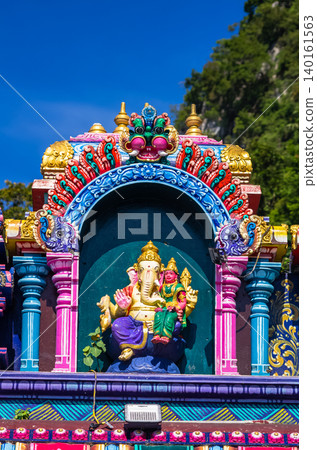 Colorful Hindu Deity Statues on Temple Facade at Batu Caves in Kuala Lumpur, Malaysia Colorful Hindu Deity Statues on Temple Facade at Batu Caves in Kuala Lumpur, Malaysia 140161563