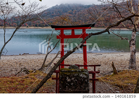 A shrine on the shore of Lake Konuma, near Mount Akagi at dusk. A shrine on the shore of Lake Konuma, near Mount Akagi at dusk. 140161859