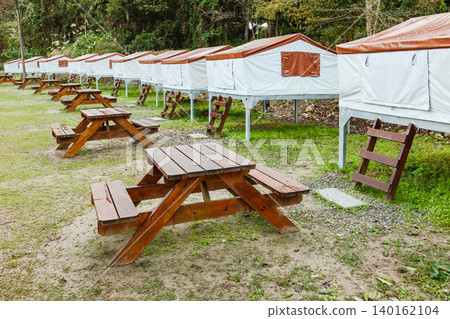 Taiwan campsite tent rows with wooden picnic table Taiwan campsite tent rows with wooden picnic table 140162104