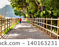 Woman walking her dog along the path by the reservoir in the Sant Llorenc de Montgai Nature Reserve, Noguera region, Lleida, Catalonia 140163231