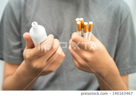 Man holding electronic cigarettes, no smoking. Man holding electronic cigarettes, no smoking. 140163467