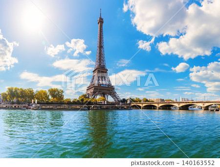 Close up view of Eiffel Tower by Seine river bridge, Paris, France Close up view of Eiffel Tower by Seine river bridge, Paris, France 140163552