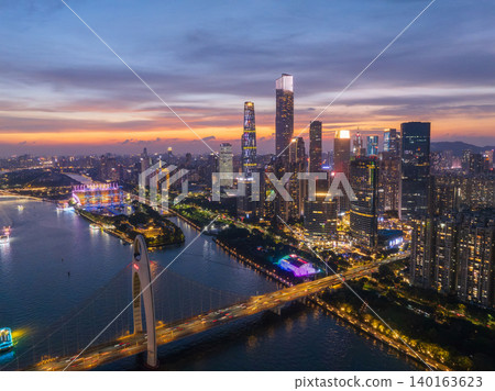 Aerial View of Guangzhou Skyline at Dusk with Illuminated Buildings and River 140163623