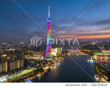 Aerial View of Guangzhou Tower Illuminated at Dusk over the Pearl River Aerial View of Guangzhou Tower Illuminated at Dusk over the Pearl River 140163624