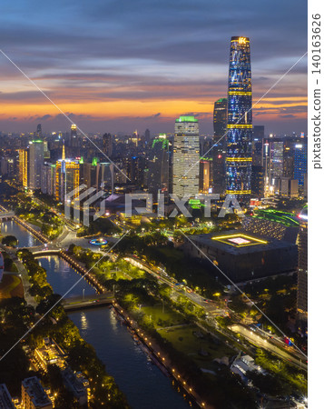 Aerial View of Guangzhou Skyline at Dusk with Vibrant City Lights Aerial View of Guangzhou Skyline at Dusk with Vibrant City Lights 140163626