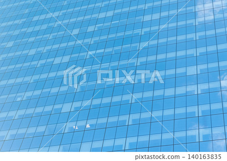 Background of glassy architecture. Modern glass background. Glass facade background. Architecture. Building facade architecture. Building background. Glass building window. Architectural detail 140163835