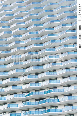 Modern glass background. Glass facade background. Architecture. Building facade architecture. Building background. Glass building balconies. Architectural detail. Background of architecture 140163837