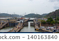 Colon, Panama - May 06, 2019: Waterway transportation. Ship at Gatun lake on the Panama canal. Waterway for sea ship transport. Opening gateway. Transport passing through Panama Canal 140163840