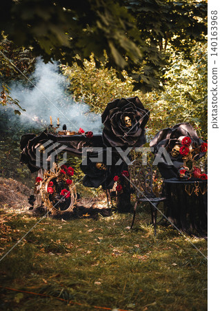 Gothic Outdoor Tea Party with Black Roses and Skull Gothic Outdoor Tea Party with Black Roses and Skull 140163968