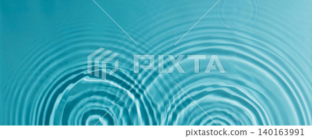 Clear blue water surface with ripples from drops as background Clear blue water surface with ripples from drops as background 140163991