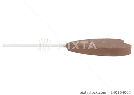 Heart-shaped chocolate on a stick isolated on white background Heart-shaped chocolate on a stick isolated on white background 140164003