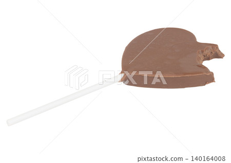 Heart-shaped chocolate on a stick bite isolated on white background 140164008