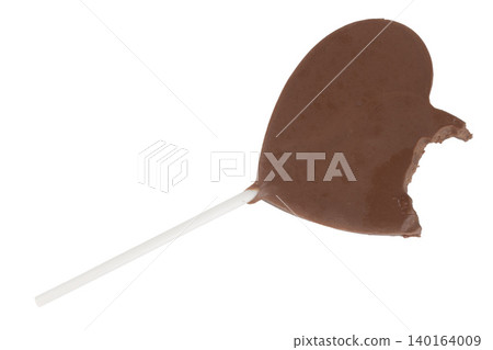 Heart-shaped chocolate on a stick bite isolated on white background 140164009