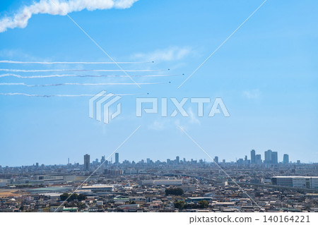 The Blue Impulse aerobatic team flies over Komaki City at the Komaki Air Base Air Festival (Komaki City, Aichi Prefecture). The Blue Impulse aerobatic team flies over Komaki City at the Komaki Air Base Air Festival (Komaki City, Aichi Prefecture). 140164221