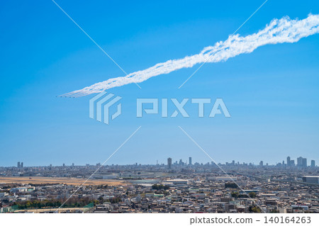 The Blue Impulse aerobatic team flies over Komaki City at the Komaki Air Base Air Festival (Komaki City, Aichi Prefecture). The Blue Impulse aerobatic team flies over Komaki City at the Komaki Air Base Air Festival (Komaki City, Aichi Prefecture). 140164263