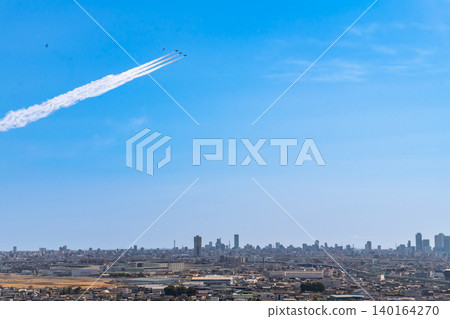The Blue Impulse aerobatic team flies over Komaki City at the Komaki Air Base Air Festival (Komaki City, Aichi Prefecture). The Blue Impulse aerobatic team flies over Komaki City at the Komaki Air Base Air Festival (Komaki City, Aichi Prefecture). 140164270