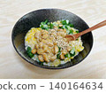 Rice with natto and egg, with green onions. 140164634